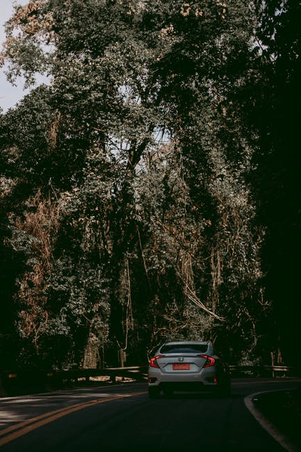 A close up of a car going down the road